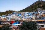 The blue houses of Chefchaouen below the green Rif mountains