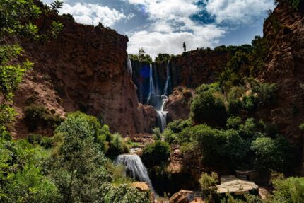The Ouzoud Waterfalls dropping into a green gorge